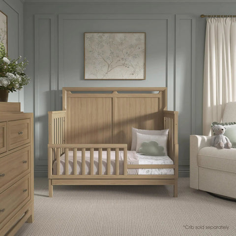 Bradford Toddler Bed Rail Conversion Kit for Full Size Cribs Pinewood Guard Rail in nursery setting.