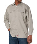 Mens Long Sleeve Utility Work Shirt With Tough Soil Release Fabric And Classic Seven Button Front Featuring Roomy Chest Pockets Built Different For Hardcore Daily Grind And All Week Comfort, gray color, worn by man.