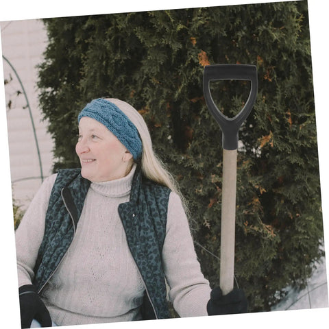Woman holding Replacement Garden Shovel Handle With Plastic Grip Universal Spade Handle For Hand Shovels in winter garden