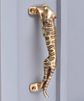Vintage Style Interior Door Pull Handle 1 Piece in Antique Brass and Gold Finish depicting a jaguar, mounted on a door.