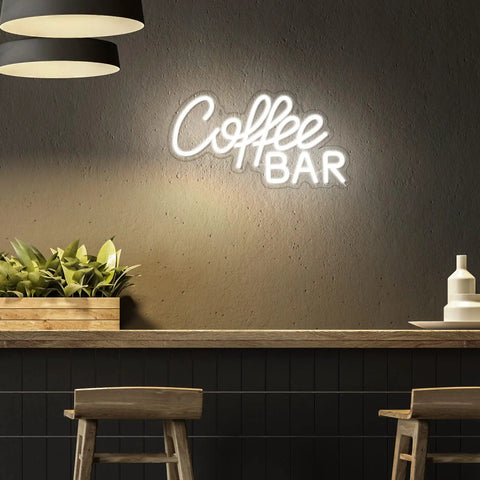 Coffee Bar Neon Sign LED Light on wall in cafe setting, modern wall decor for shops, restaurants, and pubs with white glow.