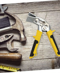 Pro Grade Hand Seamer Tool for Ductwork with ergonomic folding design and wide plate bender on wooden surface with other tools