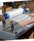 Hand Operated Unwinding Frame For Stretch Wrap Film Dispenser Tabletop Wrap Dispenser Machine Heavy Duty Metal And Plastic Construction Easy Winding And Lock Mechanism Ideal For Cargo Packing Moving And Packaging on worktable