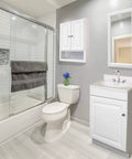 Modern bathroom with white vanity, mirror, and shower enclosure, featuring Karsen II Widespread Bathroom Faucet in Polished Chrome