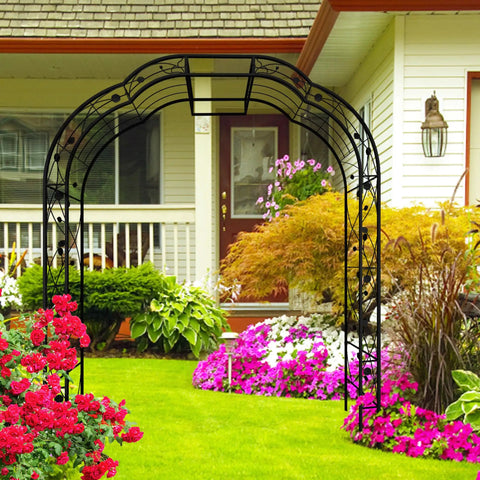 Tall Black Garden Arch Trellis 8.2 Ft High 6.2 Ft Wide Outdoor Arbor For Climbing Plants Roses And Vines in a garden setting
