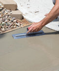 Using QLT Concrete Finishing Trowel With Soft Grip Handle For A Smooth Cement Finish on wet cement, 14 by 4 inch carbon steel blade