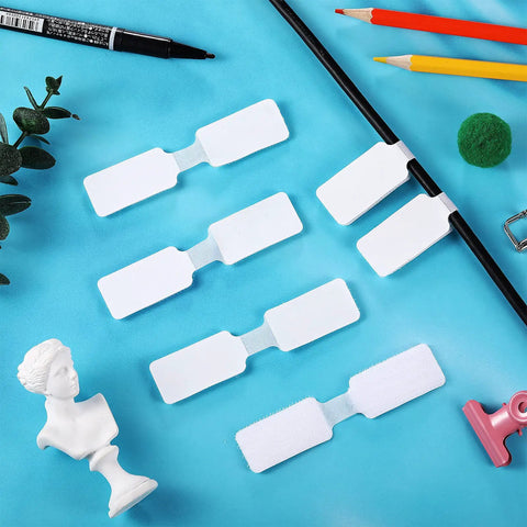 60 Pieces Self Adhesive Cable Labels For Wires And Cords, Nylon Writable Tags displayed on blue surface with stationery items.