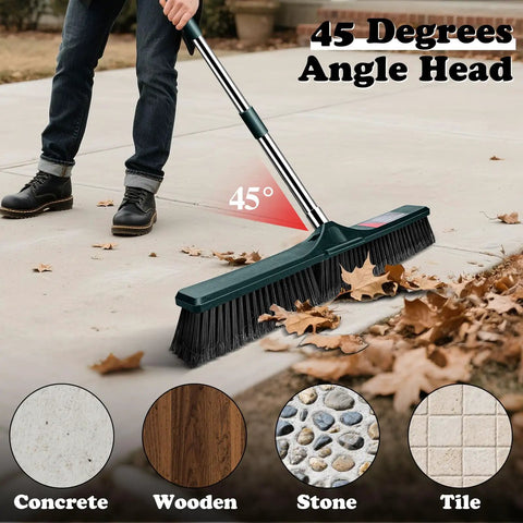 Heavy Duty Outdoor Push Broom With Hella Durable Stiff Bristles And 58 Inch Long Handle sweeping leaves at 45 degrees on concrete.