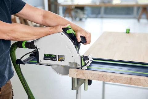 Person using a 100 Year Limited Edition Guide Rail 55 Inch Track Saw Rail For TSC 55 TS 55 TS 75 Splinter Free Edge Guard Anti Slip Surface And Pro Grade Beefy Precision Alignment For Smooth Fast Cuts On Long Projects on a wooden board
