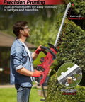 Person using Cordless Hedge Trimmer 21V With 4000mAh Battery, 14 Inch Dual Action Blades to trim hedge