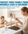 Woman testing water in kitchen with 21 In 1 Drinking Water Test Kit For Tap And Well With 120 Strips And 4 Bacteria Tests, child nearby.