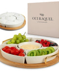 Chip and Dip Serving Set with 13.5 Inch Ceramic Platters and Trays, filled with assorted fruits and dips on a rotating base.
