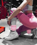 Badass Leg Straps For Cable Machines And Home Gym Hustle, dual pack neoprene ankle straps secured on the legs during workout.