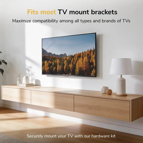 Top Shelf Universal TV Mount Hardware Kit Loaded With Premium Vesa Screws Security Washers And Precision Spacers For A Bulletproof Wall Setup On 19 To 85 Inch Flat Screens mounted on a wooden cabinet.