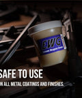 Extreme Weapons Grease EWG For Firearms, Synthetic Light Grease With Extreme Pressure, 4 Oz jar next to firearm parts