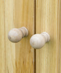 Top Shelf 32 Inch Galvanized Top Workshop Cabinet With Dual Shelves And Rust Resistant Farmhouse Doors knob close-up on natural wood.