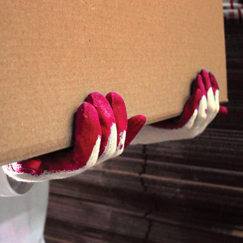 Person wearing All Purpose Non Slip Red Latex Palm Coated Work Safety Gloves For Garden And Warehouse Tasks Grippy Feel All Day Comfort