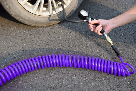 Using Purple Polyurethane Recoil Air Hose For Air Compressors One Quarter Inch Inner Diameter By Twenty Five Feet to inflate a tire