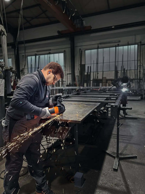 Worker using Built Tough 18 Volt Cordless Angle Grinder, Brushless Motor Workhorse For No Sweat Cutting And Deburring, Soft Start Safety, 125 Mm Disc, Tool Only Without Battery Or Charger Included on metal.