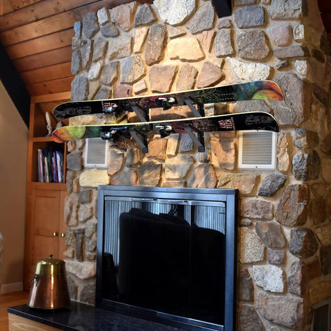 Heavy Duty Snowboard Wall Mount Rack Adjustable Ski Storage System Hella Secure Massive Space Saving Gear Holder For Home And Garage Three Pack Street Smart Setup with two snowboards mounted on a stone wall.