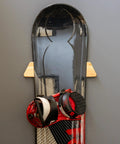 Sturdy Solid Wood Snowboard Rack Wall Mount For Home Or Garage Featuring Adjustable Width And Tight Grip Supports Holding Up To Thirty Pounds Hella Smooth Gear Storage with snowboard and bindings mounted.