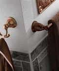 Brantford 24-Inch Towel Bar In Oil Rubbed Bronze ORB installed in classic bathroom corner with brown towel