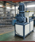 Close-up of the Beast 220V Universal Biaxial Metal Shredder Crusher Machine in a workshop setting.