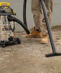 Person using 8 Gallon Wet Dry Vacuum With 4 HP Peak Motor, Heavy Duty Shop Vac With Attachments, Blower Function on concrete floor