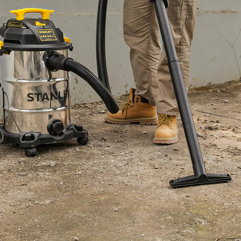 Person using 8 Gallon Wet Dry Vacuum With 4 HP Peak Motor, Heavy Duty Shop Vac With Attachments, Blower Function on concrete floor