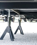 Built Tough Telescopic Rv Jack Set Of Two Adjusts Easily Between 16 And 30 Inches Quick Grip Pin Design under an RV for stability.