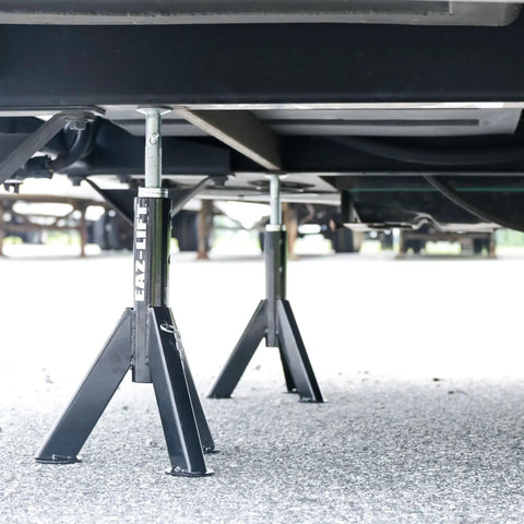 Built Tough Telescopic Rv Jack Set Of Two Adjusts Easily Between 16 And 30 Inches Quick Grip Pin Design under an RV for stability.