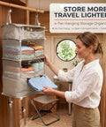 Woman using Travel Hanging Shelf Bag With 5 Tier Packing Cube Organizer in RV closet with clothes visible