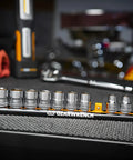 Fourteen Piece Three Eighths Inch Drive Six Point Socket Set Metric Pro Grade Chrome Plated Alloy Steel with tools in background
