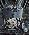 Installed view of Mofun inner camshaft bearing installer on Harley M8 engine; black rectangular tool over timing gear area.