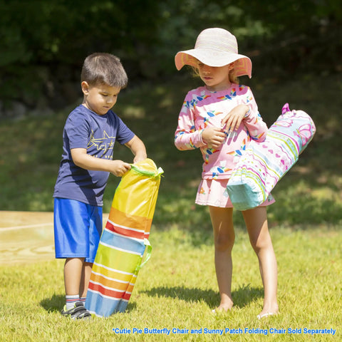 Children holding Giddy Buggy Kid-Sized Folding Lawn And Camping Chair with Cup Holder, water-resistant fabric, in outdoor setting