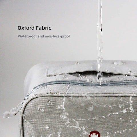 Close-up of Oxford Grey Two Pack Travel First Aid Kits With Multi Compartment Organizer Bags, waterproof material feature displayed.
