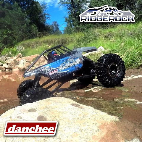 Beast 1/10 Scale 4WD Electric RC Rock Crawler climbing rocks with dual motors and 4 wheel steering in outdoor terrain