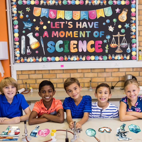 Children in front of bulletin board with Science Bulletin Board Set For Classroom Decor 89 Pcs including colorful scientific cutouts.