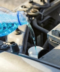 Pouring washer fluid into Direct-Fit Windshield Washer Reservoir Tank Assembly With Cap And Washer Pump Without Low Fluid Sensor For 2009-2013 Toyota Corolla And 2009-2012 Toyota Matrix Without Rear Wiper Aftermarket Replacement