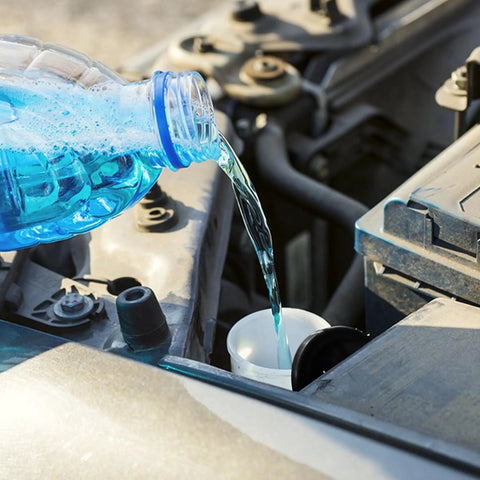 Pouring washer fluid into Direct-Fit Windshield Washer Reservoir Tank Assembly With Cap And Washer Pump Without Low Fluid Sensor For 2009-2013 Toyota Corolla And 2009-2012 Toyota Matrix Without Rear Wiper Aftermarket Replacement