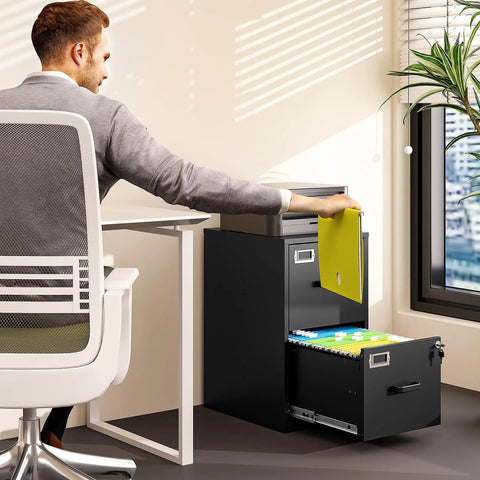 Man using Two Drawer Steel File Cabinet With Lock in home office, vertical filing for Letter A4 legal files, deep drawers visible