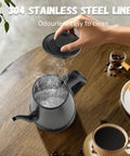 Electric Kettle With 1L Capacity And Gooseneck Spout, 1000W Quick Boil In 3 Minutes, 304 Stainless Steel Tea And Pour Over Coffee Kettle For Office Travel Kitchen, Auto Shut Off, BPA Free, Black Star Design on table with coffee and croissants