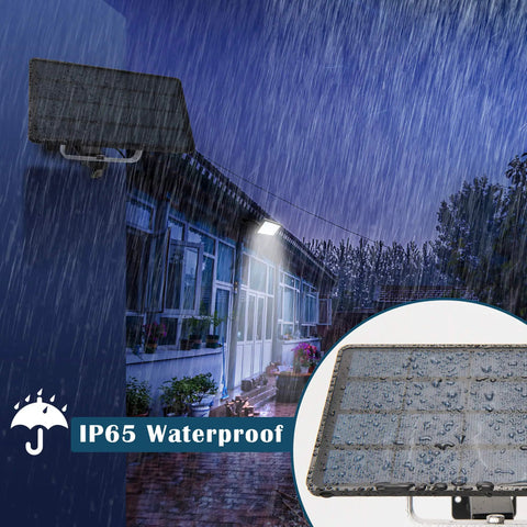 1000 Lumen 48 LED Solar Dusk To Dawn Outdoor Light With Remote Control Kit illuminating in rain showing waterproof feature