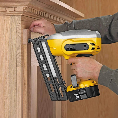 Person using yellow nail gun with 5000 Pack 18 Gauge Brad Nails 2 Inch Galvanized For Nail Gun And Pneumatic Staple Guns Heavy Duty