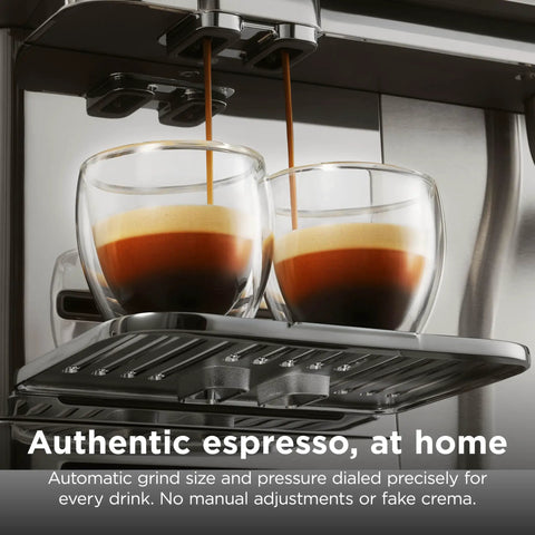 Fully Automatic Espresso Machine With 10 Custom Options And Built In Grinder Pours Barista Level Coffee into double glass cups.
