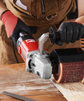 Person using Beast 1200W Burnishing Polishing Tool With Six Speed Settings Handheld Metal Buffing Machine For Stainless Steel And Nonferrous Metals Includes Four Fiber Polishing Wheels For Surface Conditioning on wood surface.