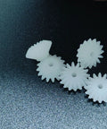Dope Ten Piece Bevel Gear Set 0.5 Module 16 Teeth 1.9mm Bore plastic S162A on dark background