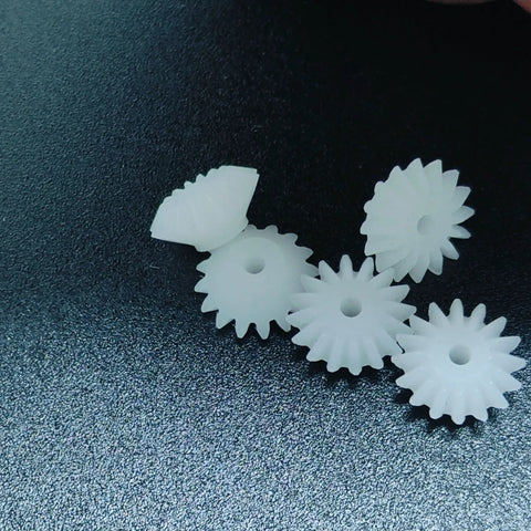 Dope Ten Piece Bevel Gear Set 0.5 Module 16 Teeth 1.9mm Bore plastic S162A on dark background