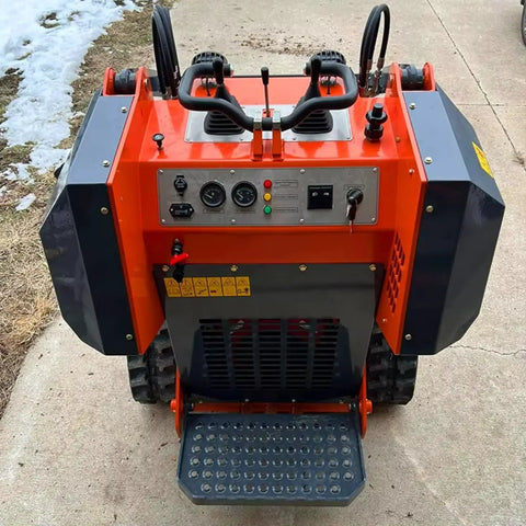 Rear view of Compact 460 Mini Skid Steer Loader showing controls for front loader and hydraulic grapple bucket attachments