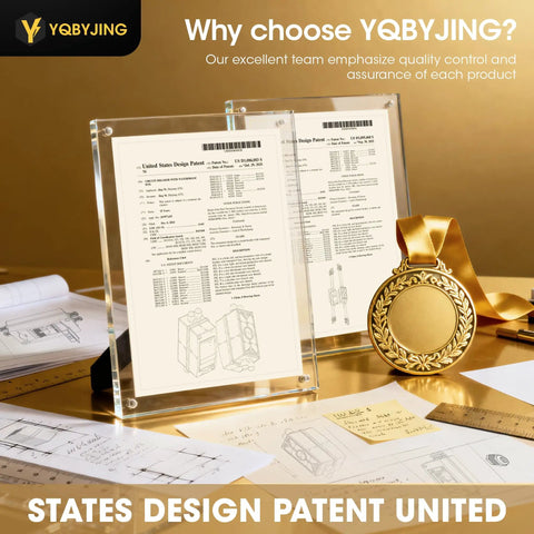 Display of state design patent certificates and a gold medal with product design schematics on a desk.